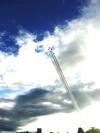 Low angle view of airplane flying against sky