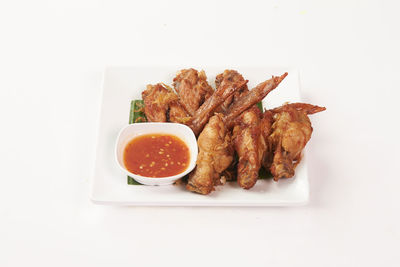 High angle view of breakfast on plate against white background