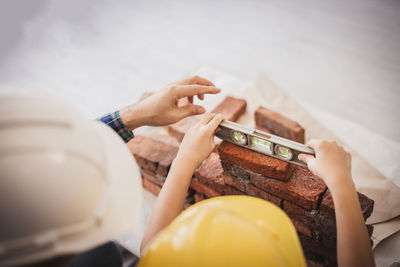 High angle view of woman hand holding ball