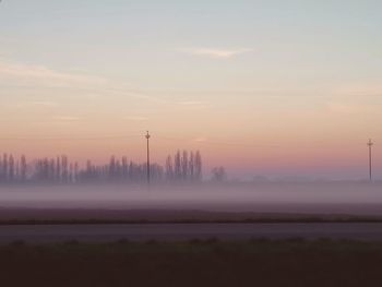 Scenic view of landscape against sky during sunset