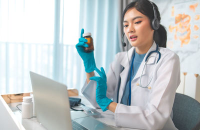 Young woman using laptop on table