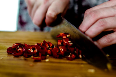 Close-up of man preparing food on table