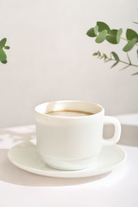 Close-up of coffee cup on table