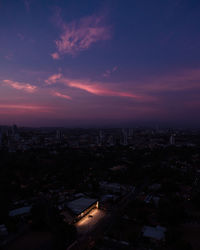 High angle view of illuminated buildings against sky during sunset