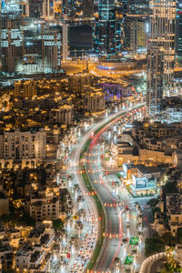 High angle view of illuminated buildings in city at night