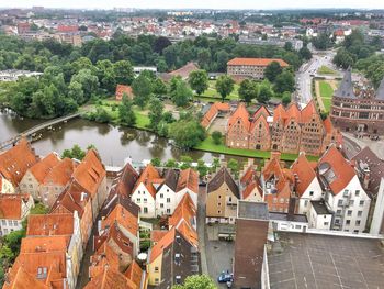 High angle view of houses in town against sky