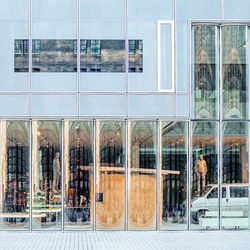 Reflection of building on glass window