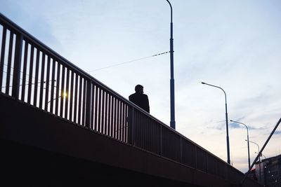 Low angle view of people against sky