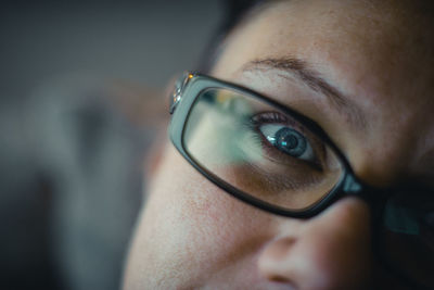 Close-up portrait of woman wearing eyeglasses