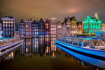 Reflection of illuminated buildings in canal at night