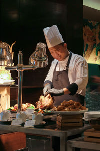 Man preparing food at restaurant