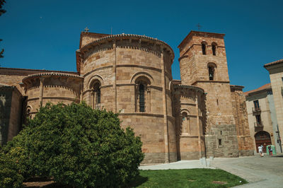 Low angle view of historic building against blue sky