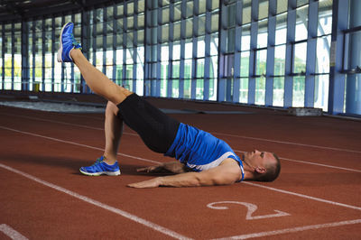 Man exercising on running track, algarve, portugal