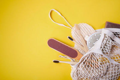 Close-up of shoes against yellow background