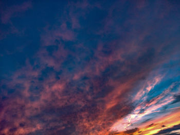 Low angle view of dramatic sky at sunset