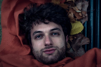 Portrait of young man lying down