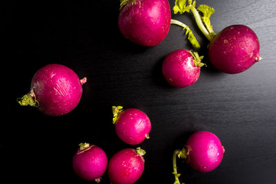 Close-up of fruits over black background