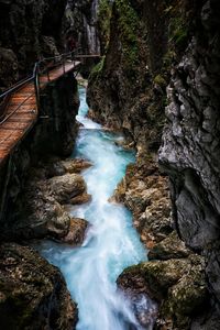 Stream flowing through rocks in forest