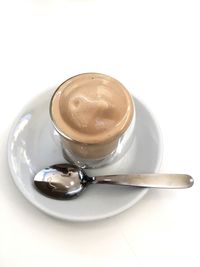 Close-up of coffee cup against white background