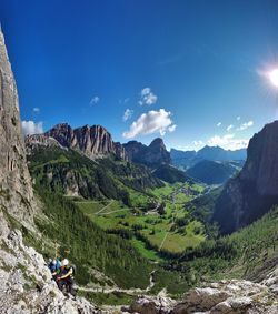 Scenic view of mountains against blue sky