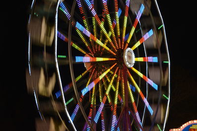 Low angle view of illuminated ferris wheel