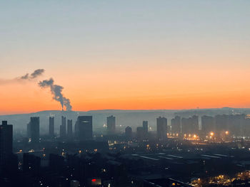 High angle view of city at sunset