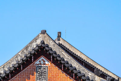 Low angle view of building against blue sky