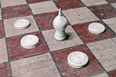 High angle view of chess pieces on board