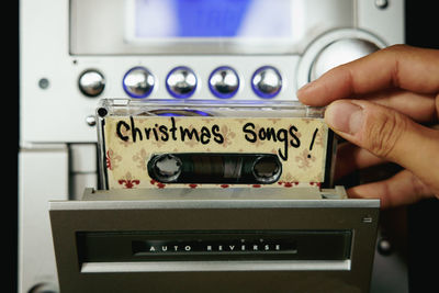 Close up from hand and cassette tapes with christmas songs