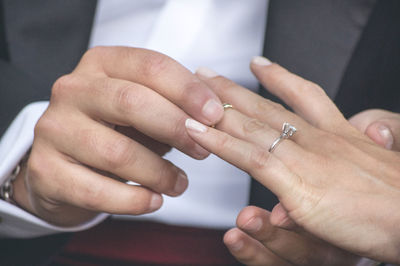 Close-up of couple holding hands