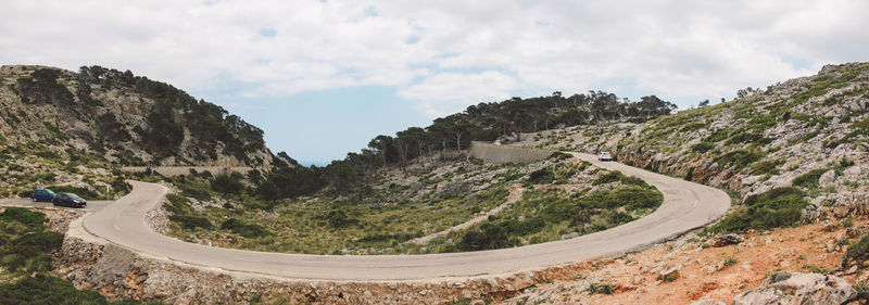 Scenic view of mountain road against sky