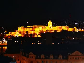 Illuminated buildings in city at night