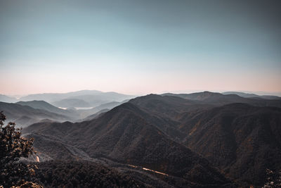 Scenic view of mountains against sky during sunset