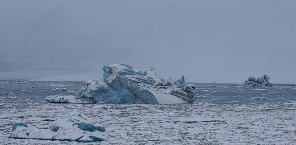 Scenic view of frozen sea against sky