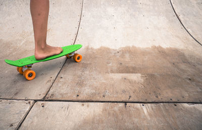 Low section of man skateboarding