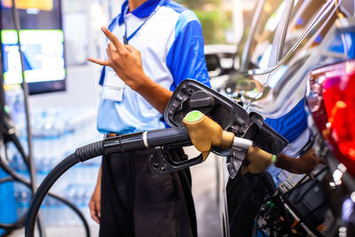 Midsection of man using mobile phone