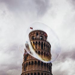 Low angle view of historical building against cloudy sky