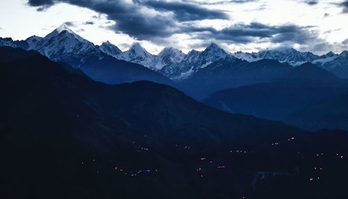 Scenic view of snowcapped mountains against sky