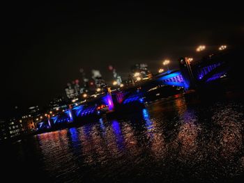 Illuminated city lit up at night