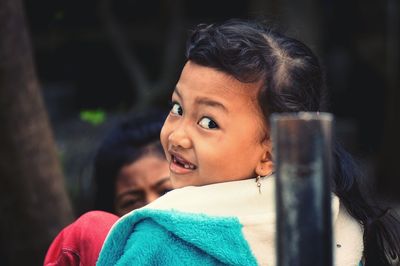 Close-up portrait of a girl looking away