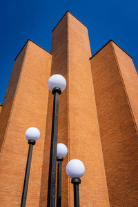 Low angle view of building against clear blue sky