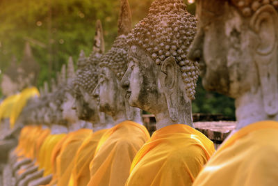 Row of buddha statues at wat yai chai mongkhon