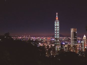 Illuminated buildings in city at night