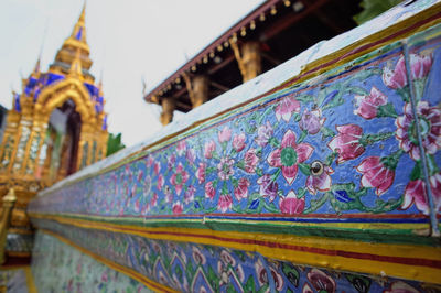 Low angle view of multi colored temple on building