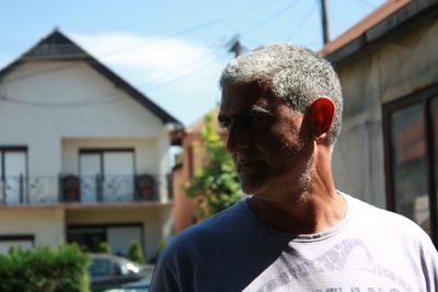 Close-up of man wearing house