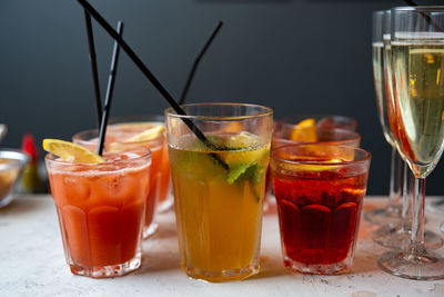 Set of cocktails and champagne in a glass on the bar table-top made for party guests