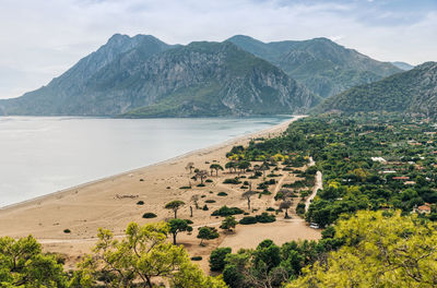 Scenic view of beach and mountains