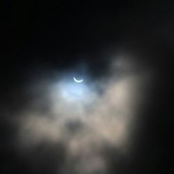 Low angle view of moon against the sky