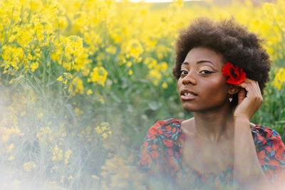 Portrait of young woman looking at camera