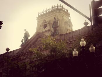 Low angle view of statue in city